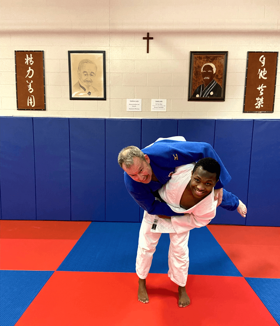 Jim Murray with Student Jucoy Baatjes, fooling around at the dojo